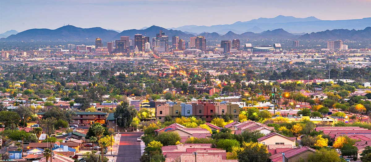 view from az suburb with phoenix cityscape in background at dusk