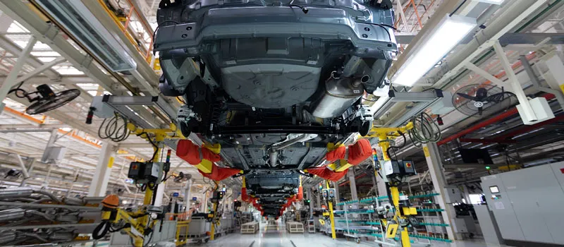 view of under a car on factory line