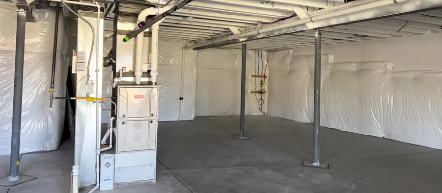 furnace in an unfinished basement
